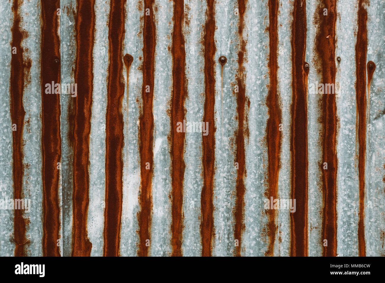 Old rusty zinc wave ceiling tile for construction. Stock Photo