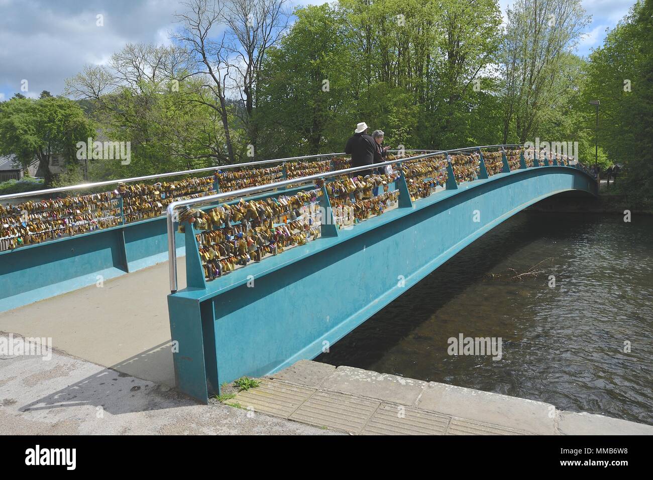 The lock bridge over the river Wye in Bakewell, Derbyshire.Thousands of locks, mostly engraved, have been put there to show undying love. Stock Photo