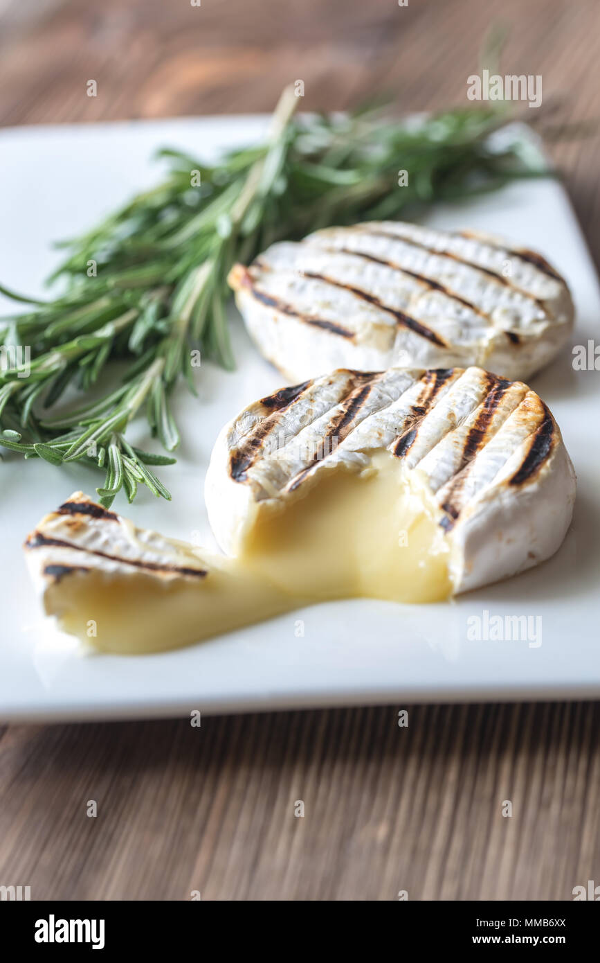 Grilled Camembert cheese with fresh rosemary Stock Photo Alamy