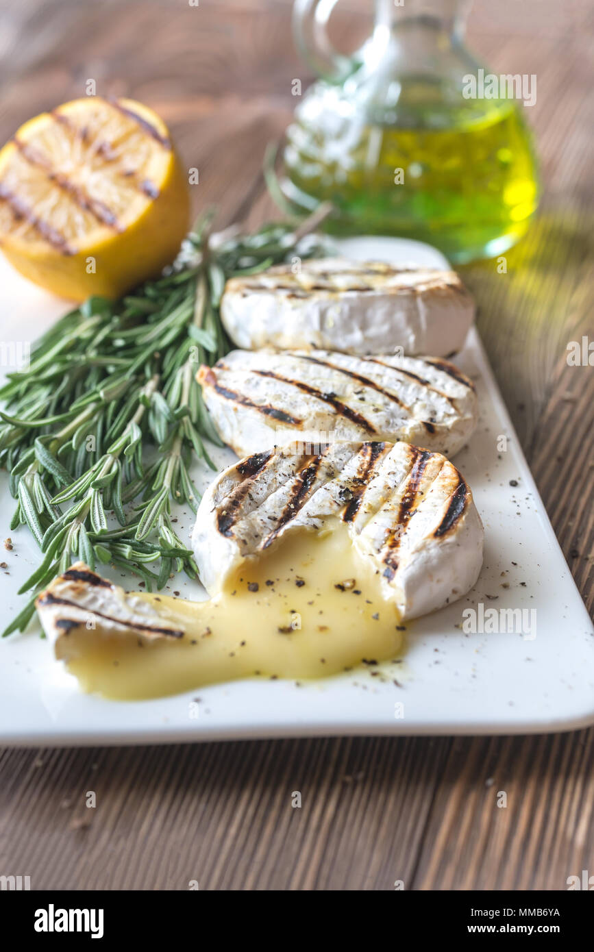Grilled Camembert cheese with olive oil and rosemary Stock Photo Alamy
