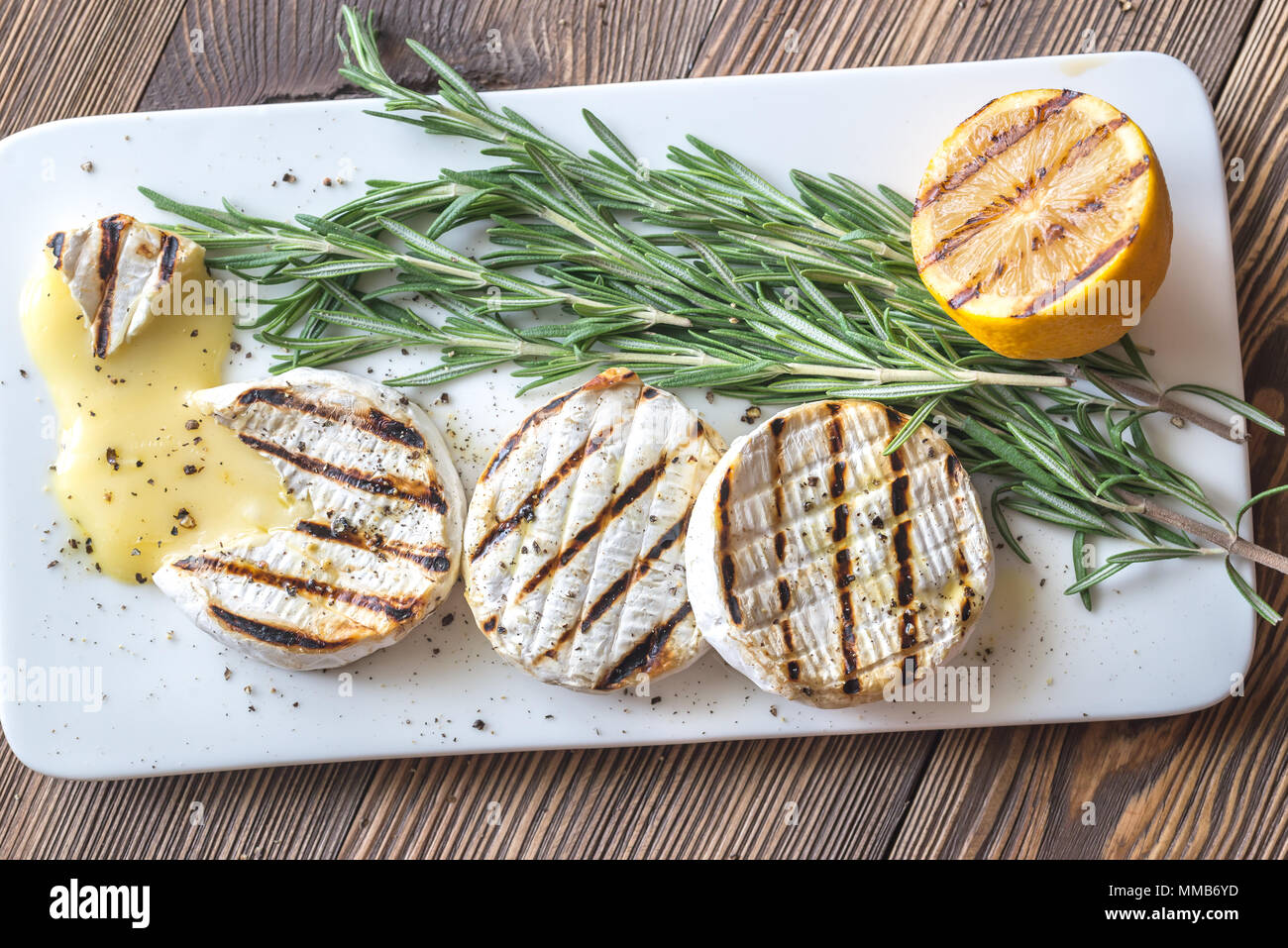 Grilled Camembert cheese with rosemary Stock Photo Alamy