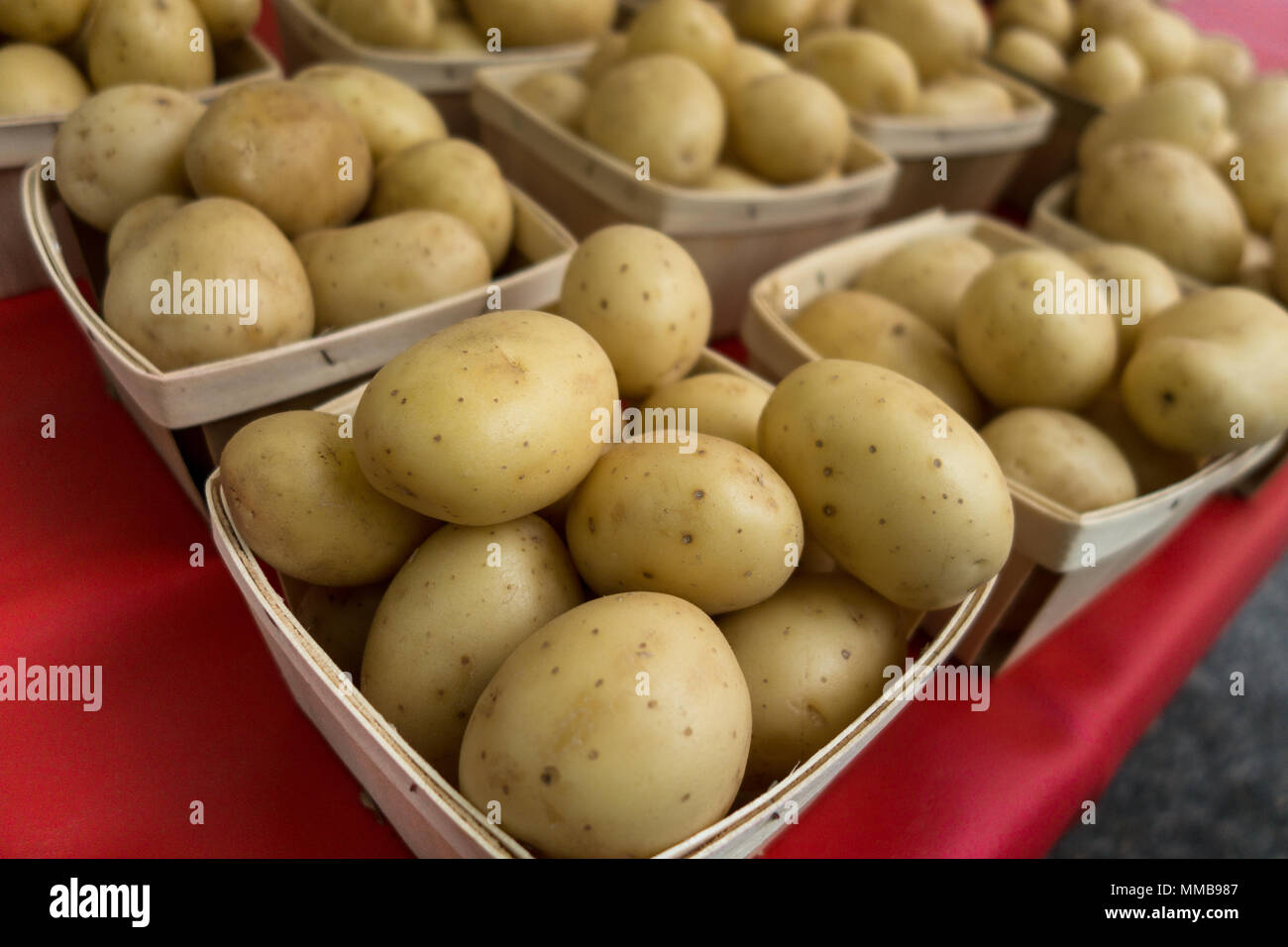 Baskets of potatoes for sale at a farmers market Stock Photo Alamy
