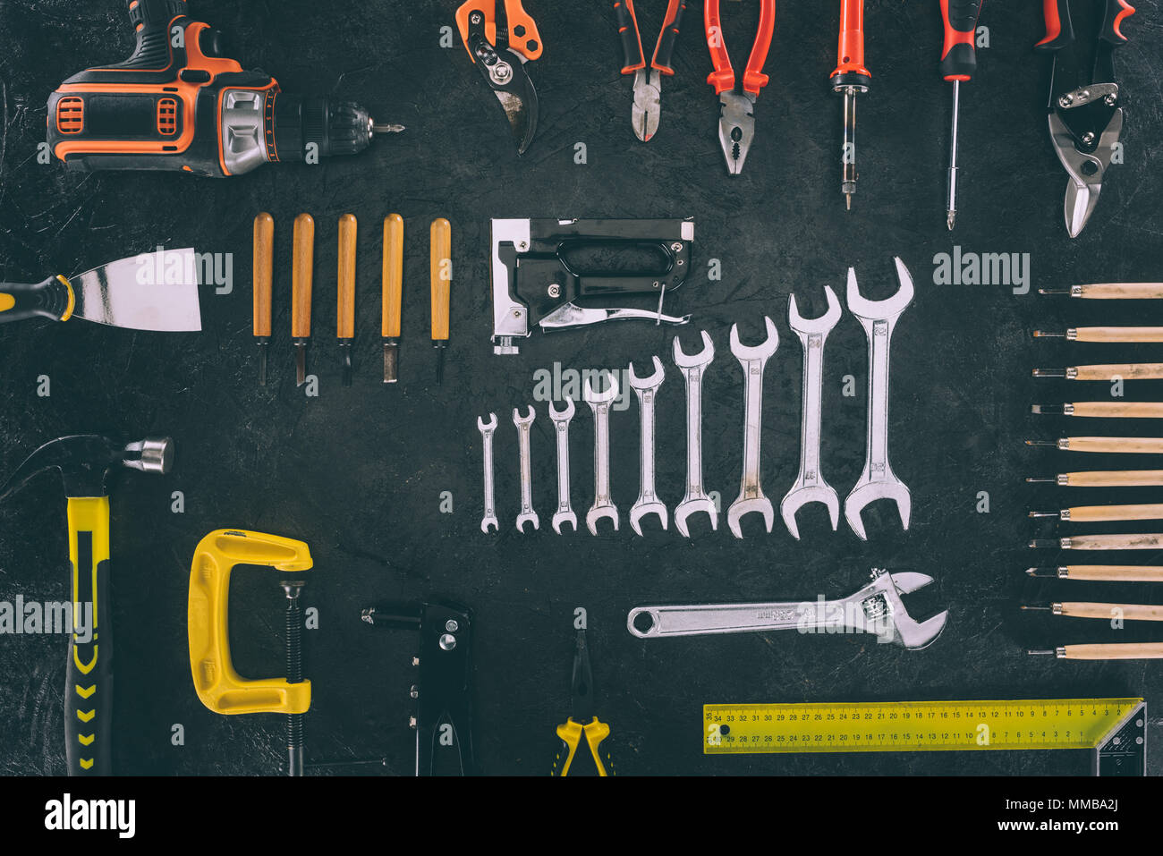 top view of set of mechanical equipment on dark tabletop Stock Photo