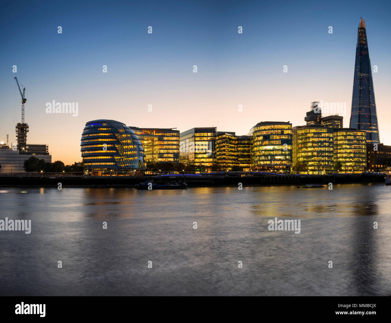 Stunning London City skyline landscape at night with glowing city ...