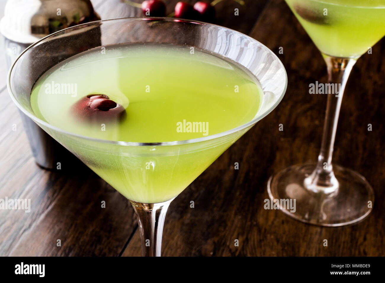 Appletini Cocktail with cherry on wooden surface. Summer Concept Stock ...