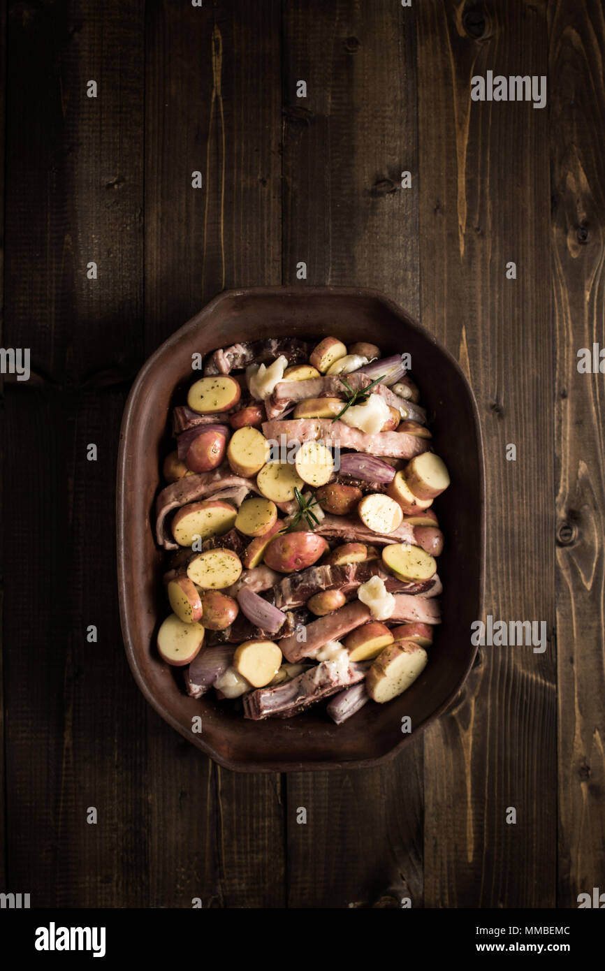 Lamb Loin Chops with Vegetables in Rustic Clay Dish Prepared for