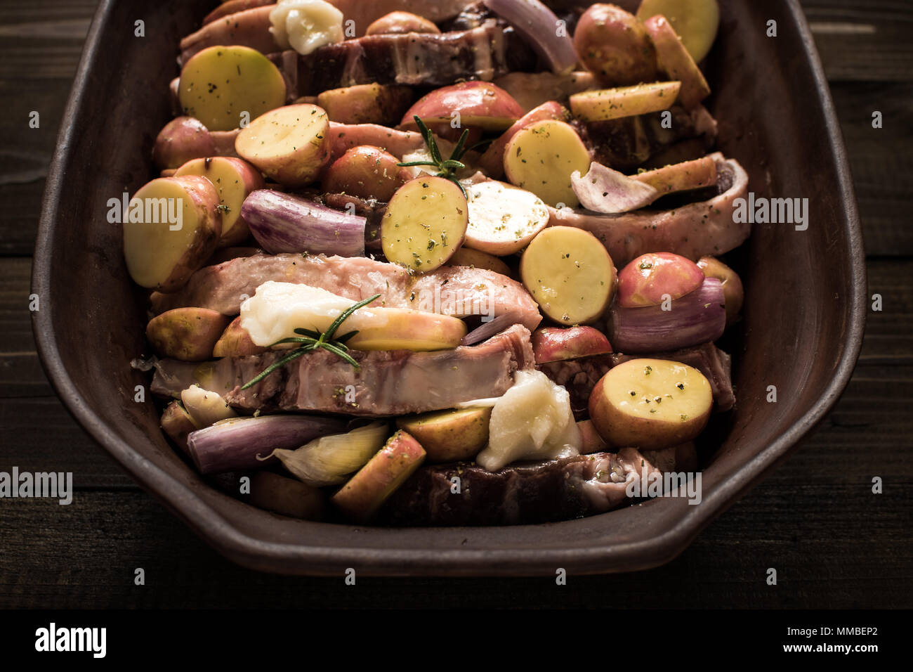 Lamb Loin Chops with Vegetables in Rustic Clay Dish Prepared for