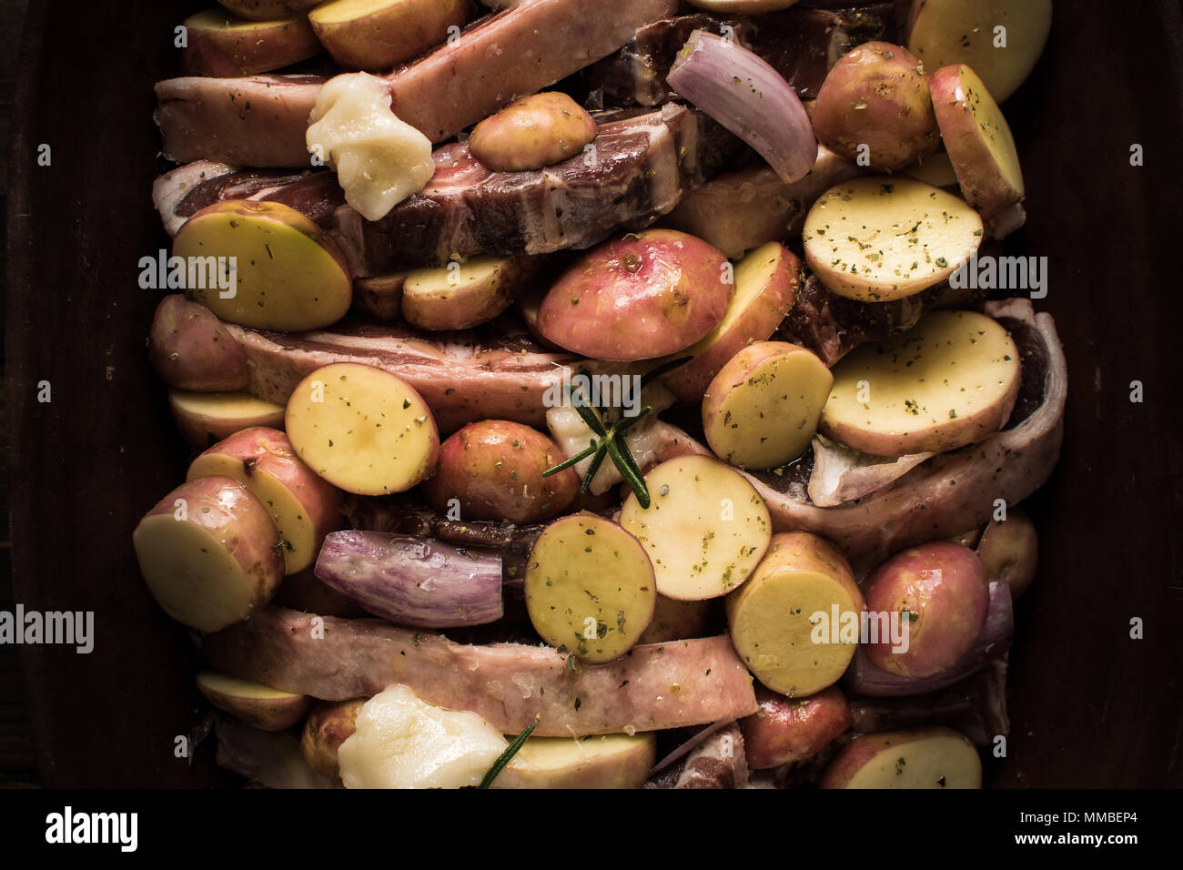 Lamb Loin Chops with Vegetables in Rustic Clay Dish Prepared for