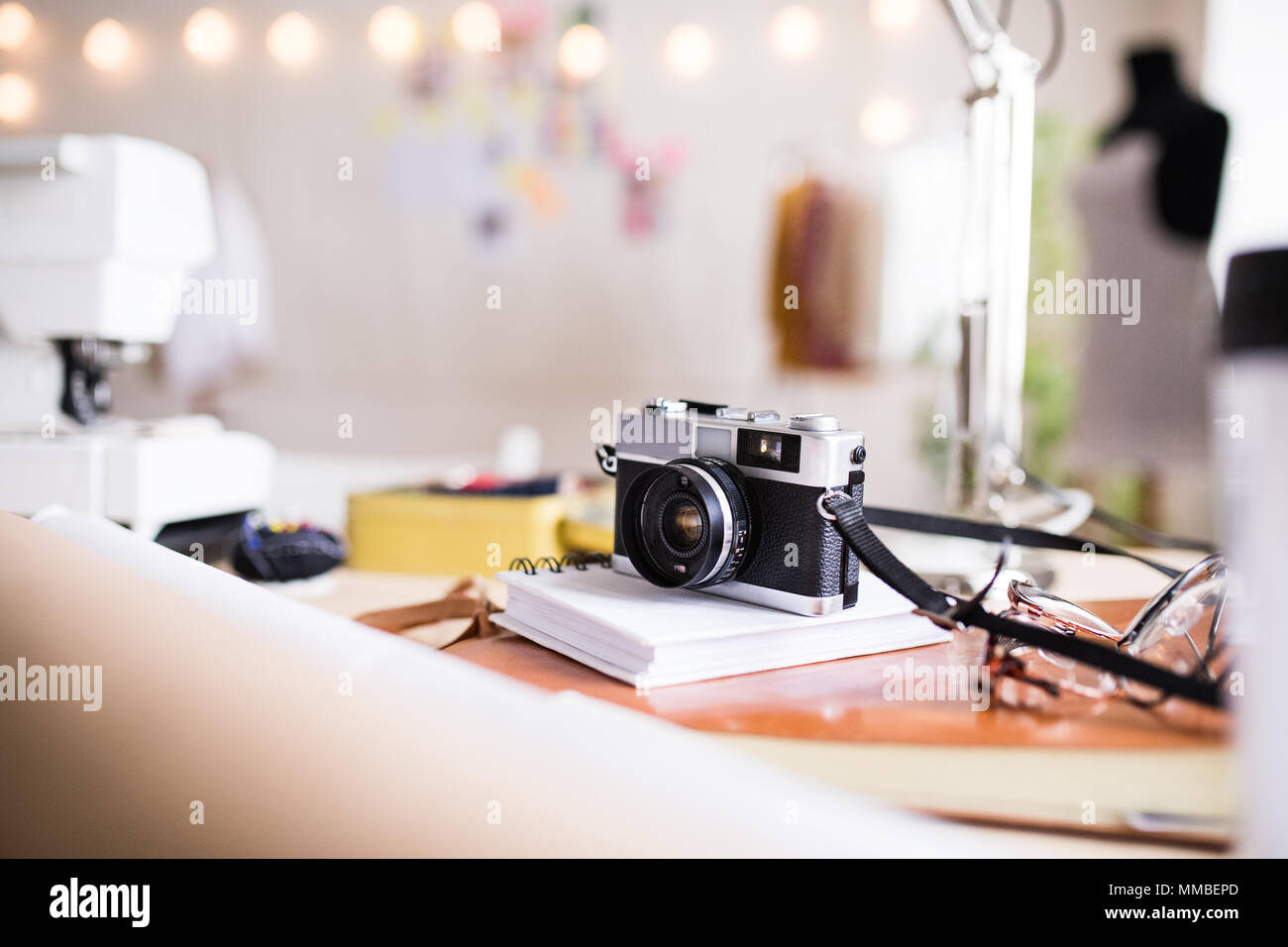 A camera on a table in interior of a studio, startup business. Stock Photo