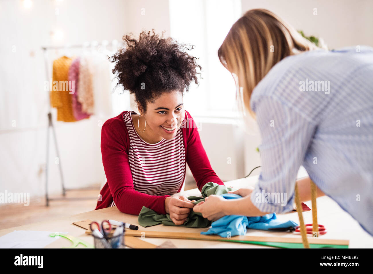 Young creative women in a studio, startup business. Stock Photo