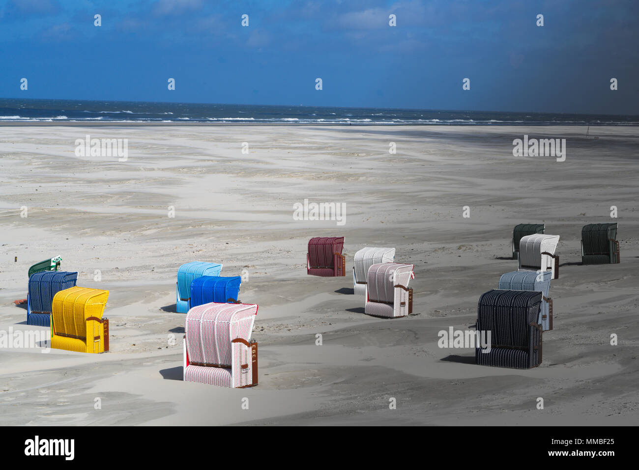 Beach With Colored Beach Chairs Left Side In The Sun Right Side In The Evening Shadow Stock Photo Alamy