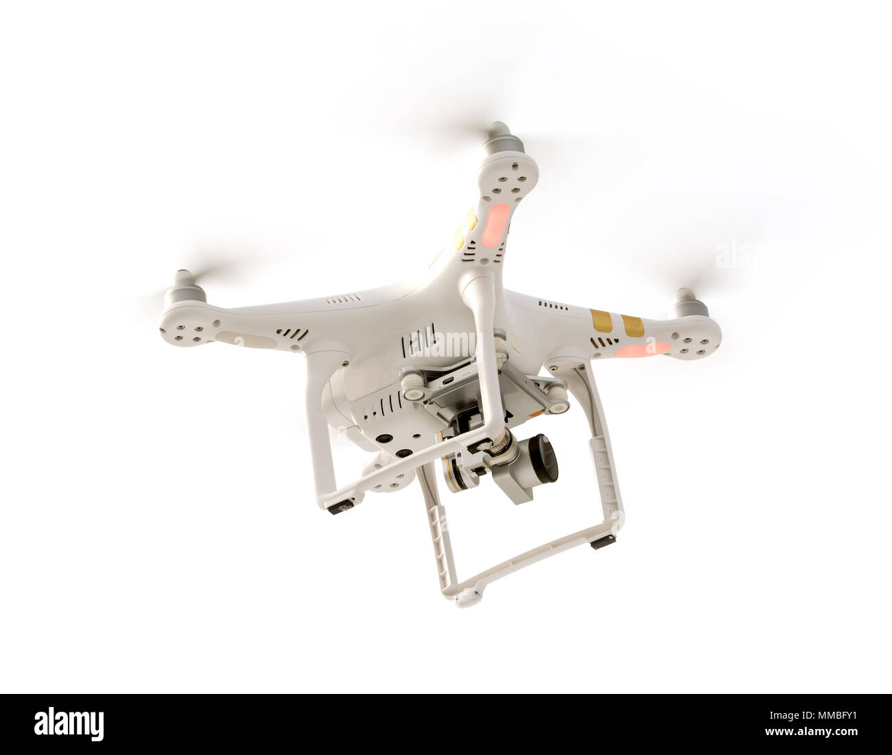 Photo of a flying camera drone isolated against a white background. Stock Photo