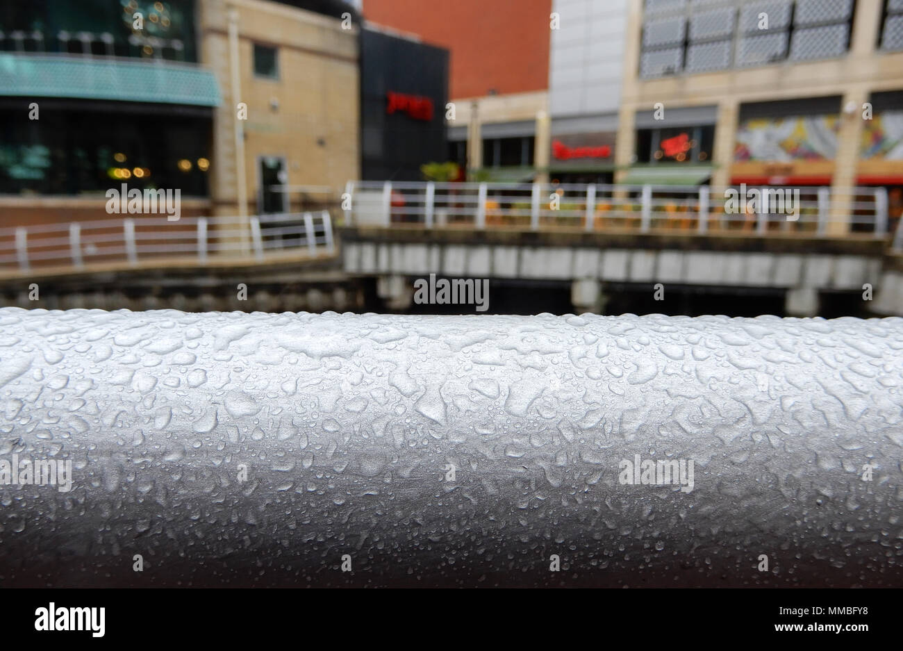 Rain on a metal balustrade by the River Thames in Reading Stock Photo