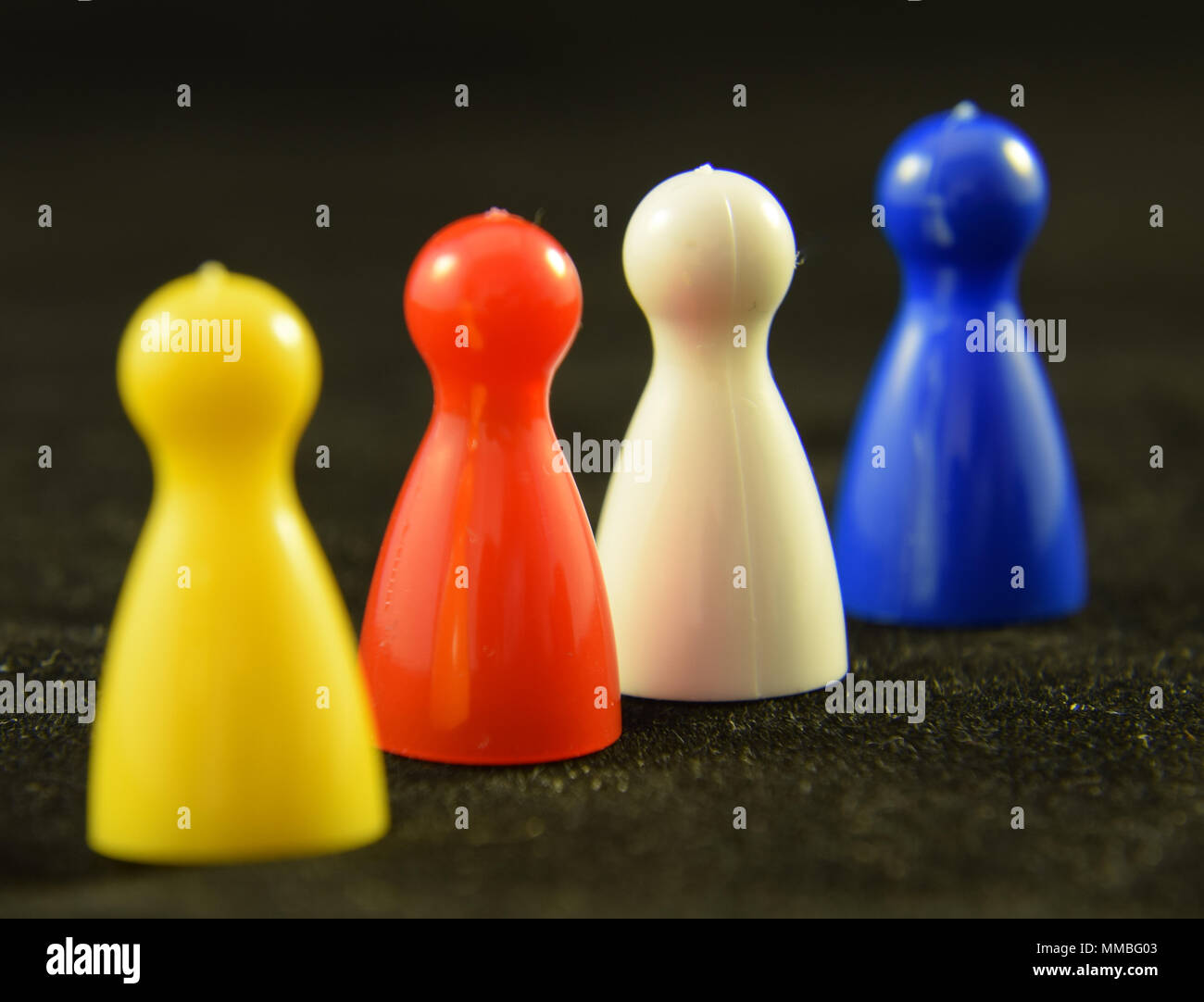 Four colourful Game counters or playing pieces frm a child's game Stock Photo Alamy