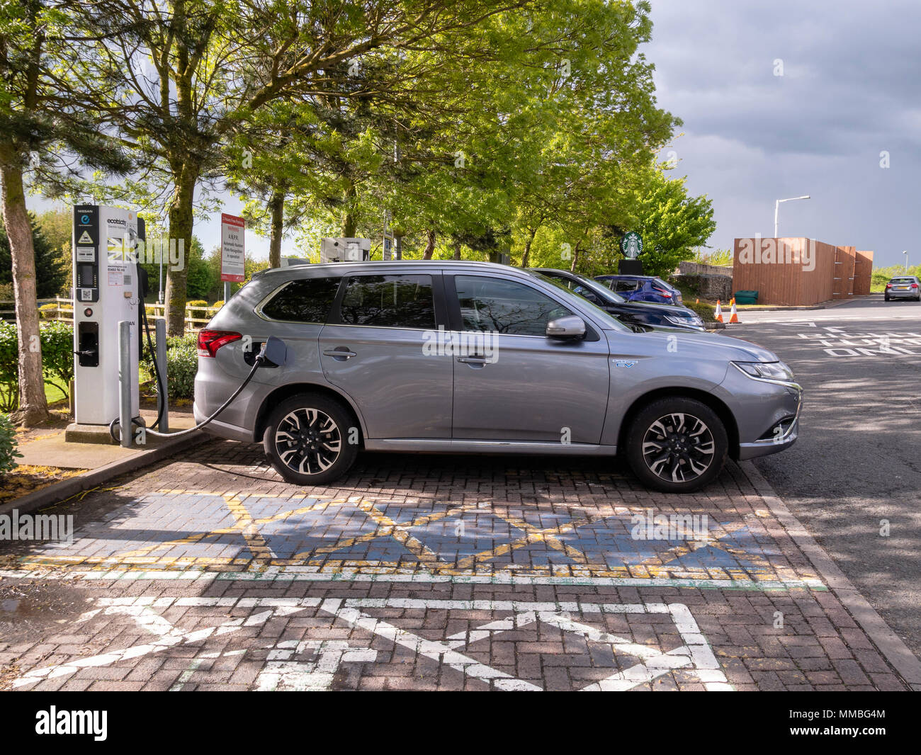 Electric car charging at the M40 services in Oxford England. Electric