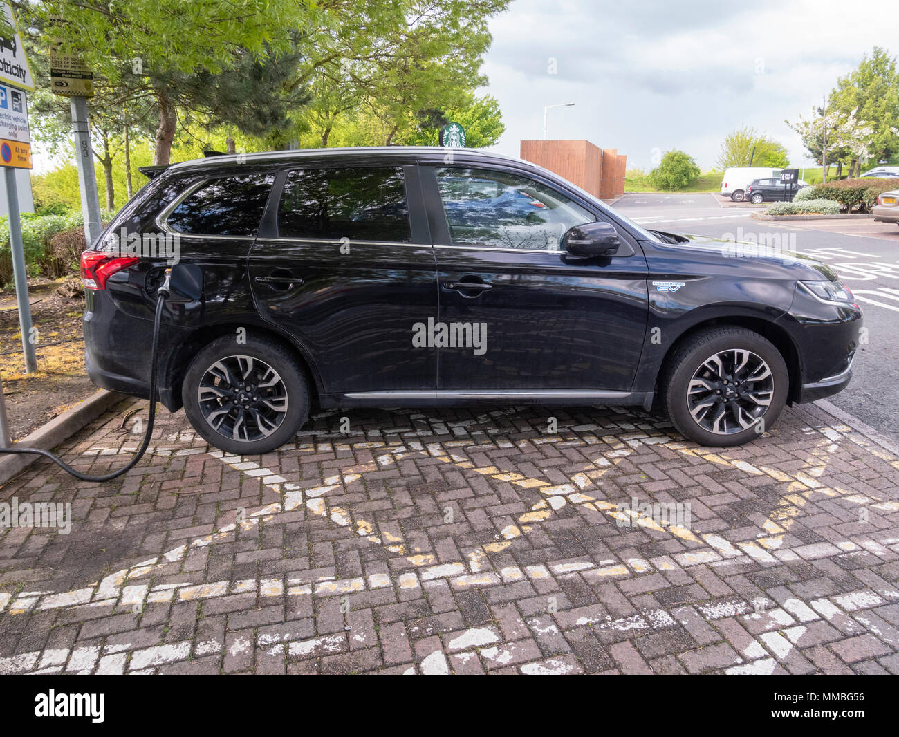 Electric car charging at the M40 services in Oxford England. Electric