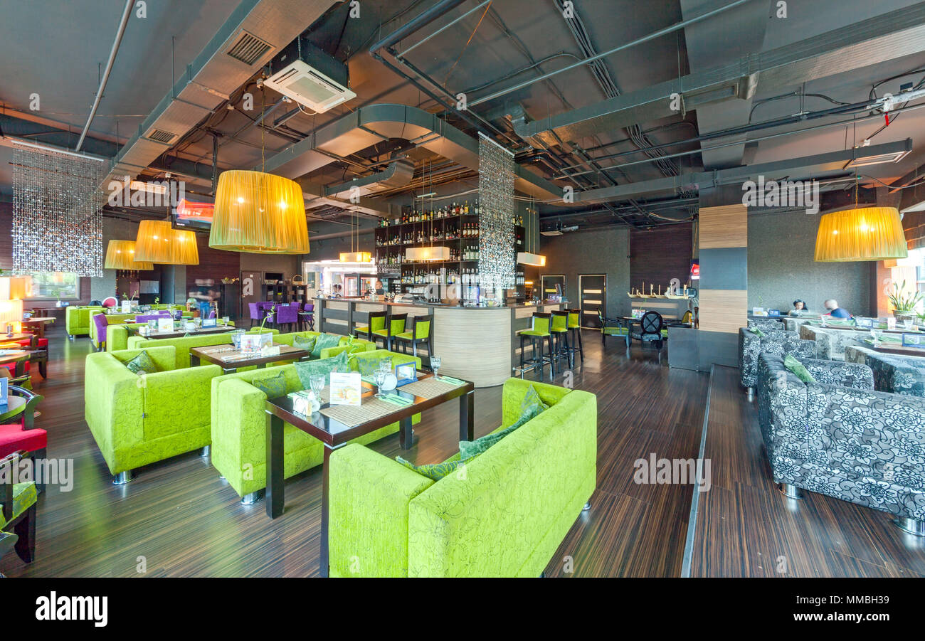 MOSCOW - AUGUST 2014: The interior of the bar restaurant 'GUAVA' in the modern and high-tech style. General view of the hall with tables and sofas Stock Photo