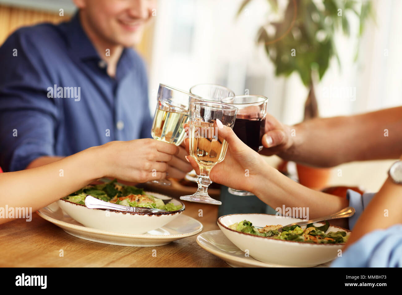 Group Of Friends Enjoying Meal In Restaurant Stock Photo