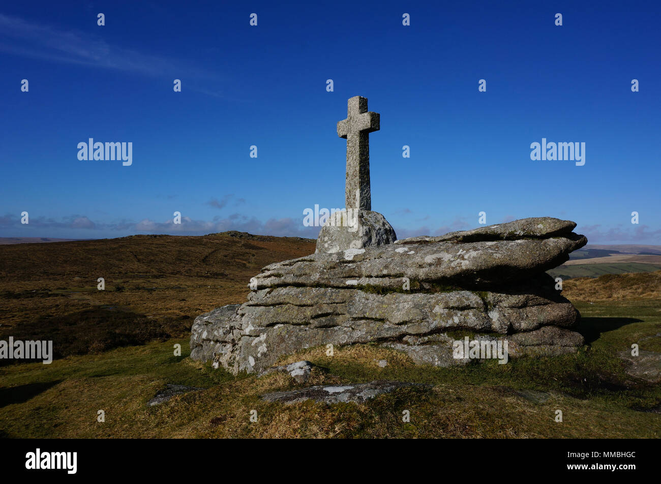 Old granite cross on Dartmoor with beautiful blue sky Stock Photo
