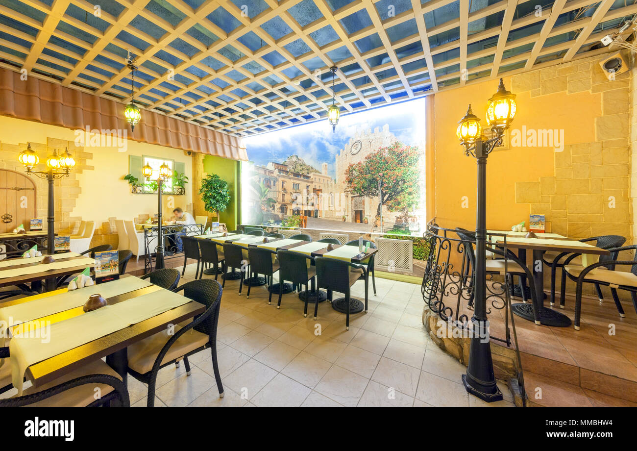 MOSCOW - AUGUST 2014: Interior of network inexpensive restaurant of Italian cuisine - 'DA PINO'. Hall decorated for the old Italian street Stock Photo