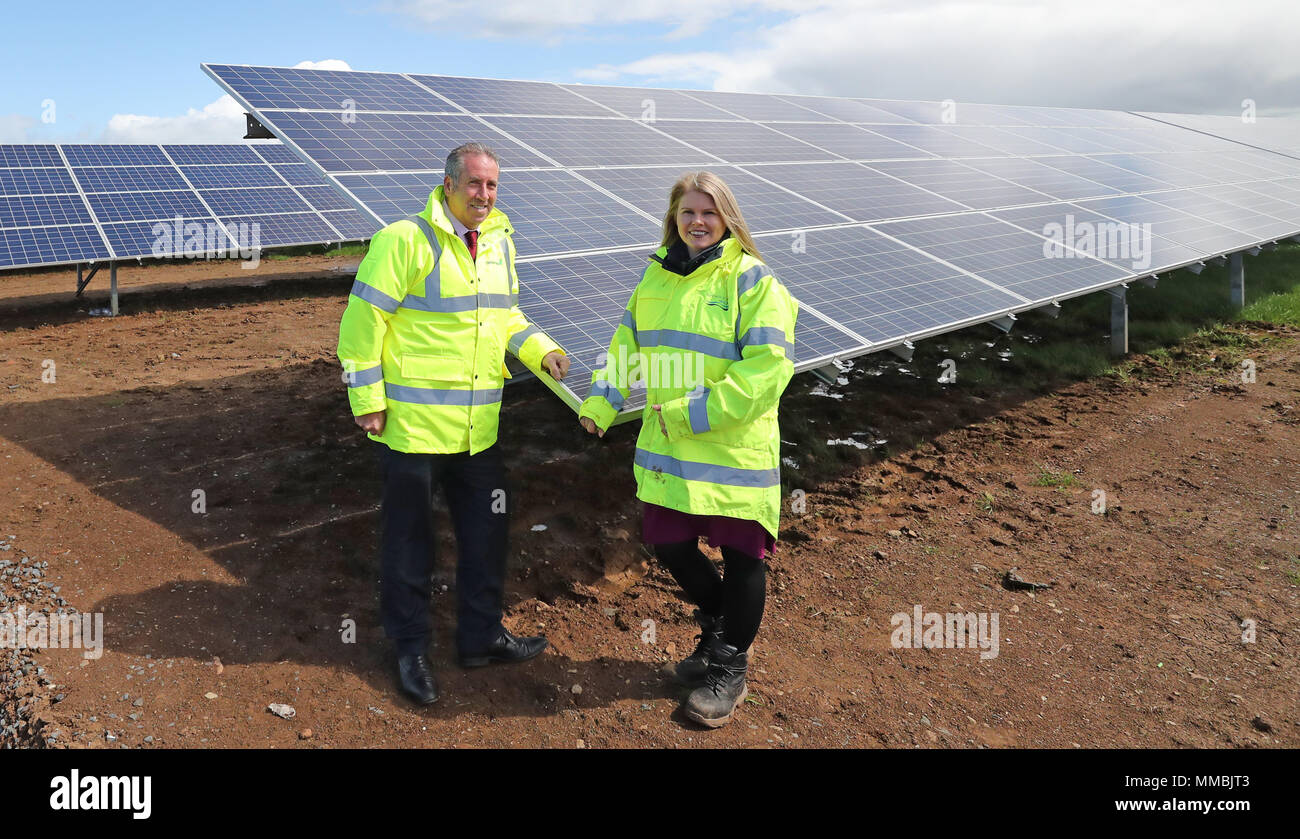 Leo Martin (left), MD of Civil Engineering at Graham Construction, with Sara Venning, CEO of NI (Northern Ireland) Water, at the opening of the new £7 million solar farm at Dunore, which will supply electricity to NI Waters Dunore Water Treatment works in South Antrim. Stock Photo