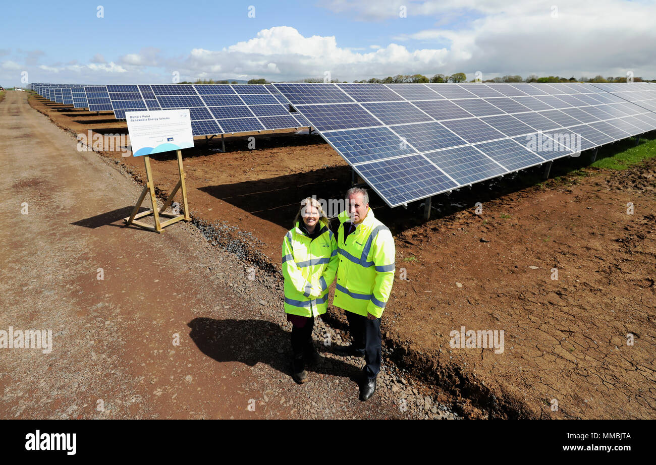 Leo Martin (right), MD of Civil Engineering at Graham Construction, with Sara Venning, CEO of NI (Northern Ireland) Water, at the opening of the new £7 million solar farm at Dunore, which will supply electricity to NI Waters Dunore Water Treatment works in South Antrim. Stock Photo