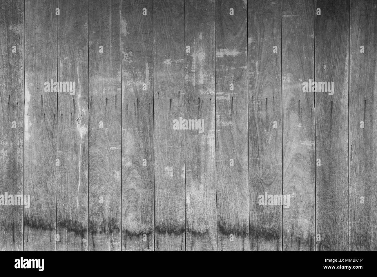 Full frame background of an old and faded wooden board wall in black and white Stock Photo