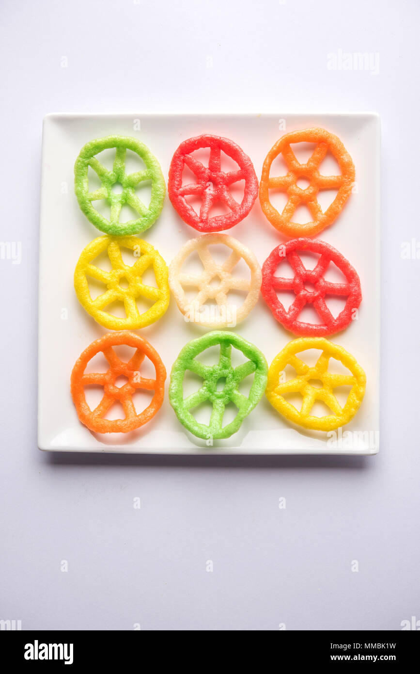 wheel shape colourful fryums papad snack. selective focus Stock Photo