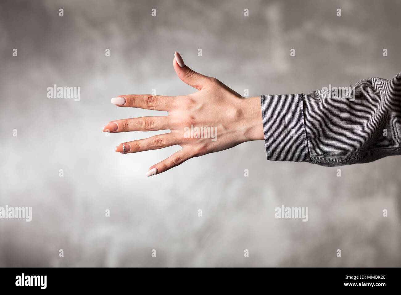 Hand back showing five fingers hi-res stock photography and images - Alamy