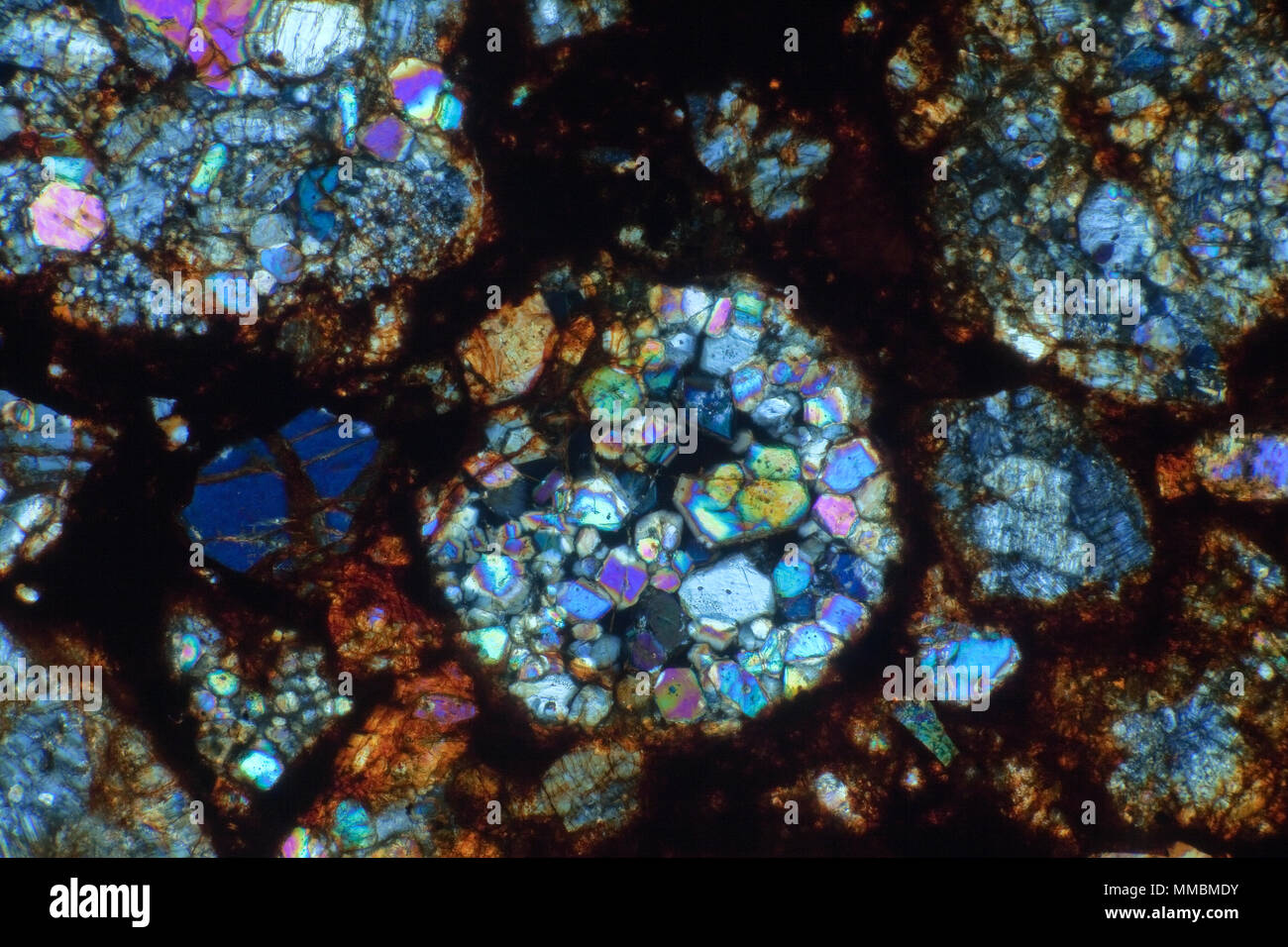 Meteorite thin slide section NWA6326 cross-polarised photomicrograph Stock Photo