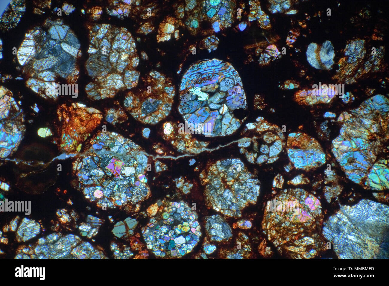 Meteorite thin slide section NWA6326 cross-polarised photomicrograph Stock Photo