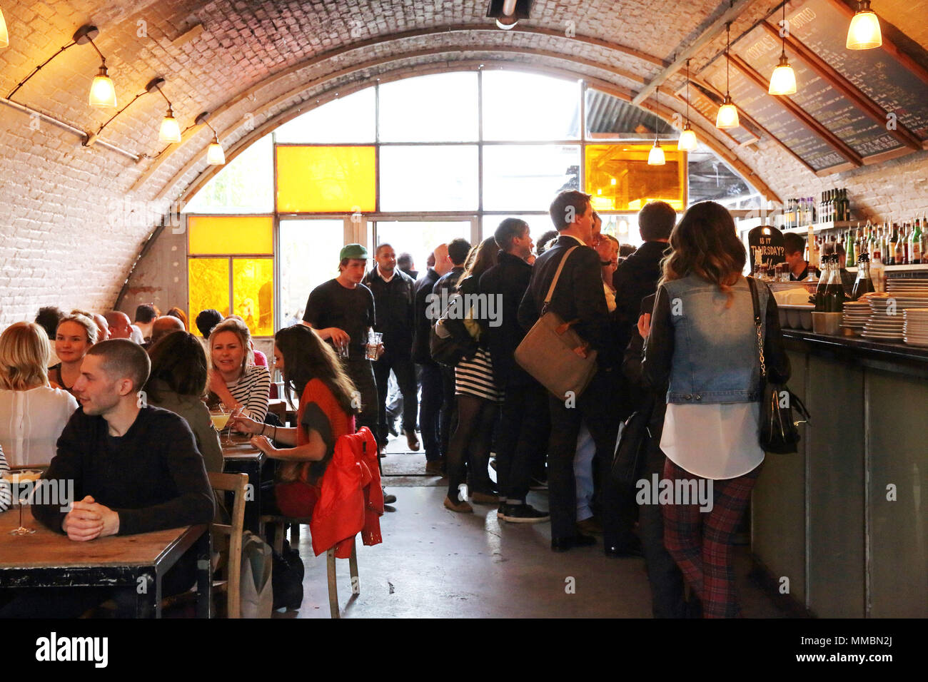 Bar Story, a trendy bar in an arch underneath Peckham Rye railway station, in London SE15, UK Stock Photo