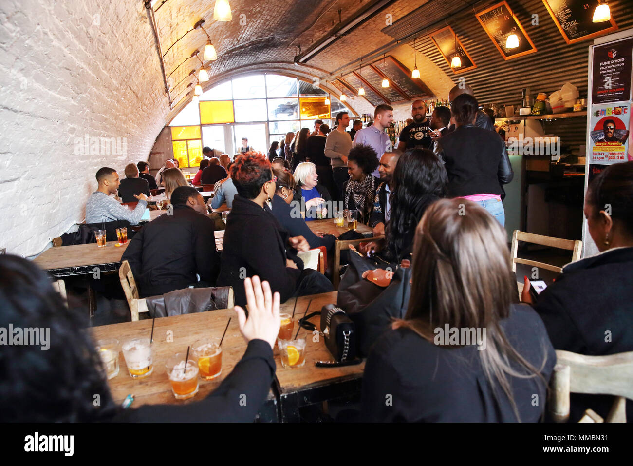 Bar Story, a trendy bar in an arch underneath Peckham Rye railway station, in London SE15, UK Stock Photo
