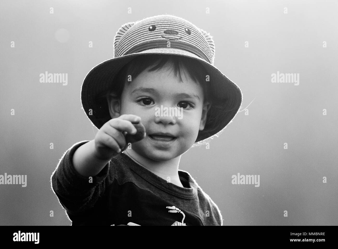 Cute baby boy with straw hat Stock Photo Alamy