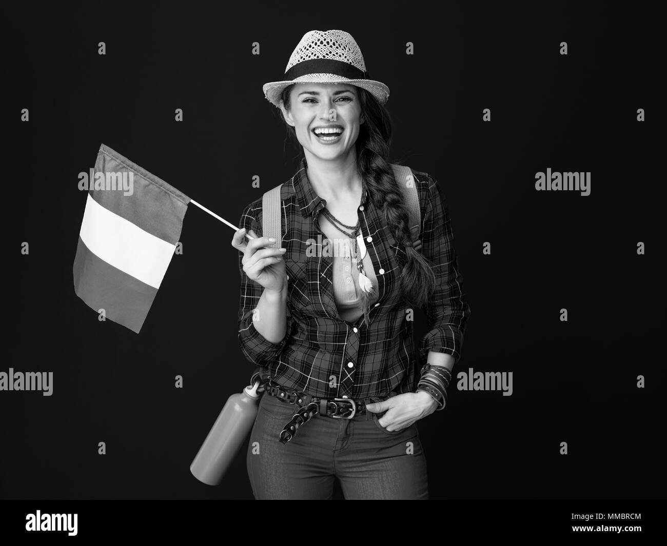 Searching for inspiring places. happy active tourist woman in a plaid shirt with the flag of Italy isolated on Stock Photo