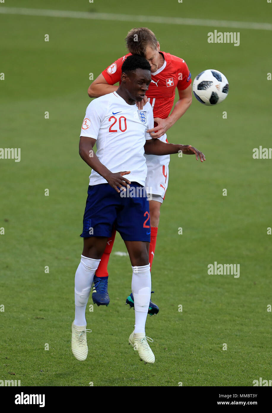 England's Folarin Balogun (left) and Switzerland's Ilan Sauter battle for the ball during the UEFA European U17 Championship, Group A match at the AESSEAL New York Stadium, Rotherham. Stock Photo