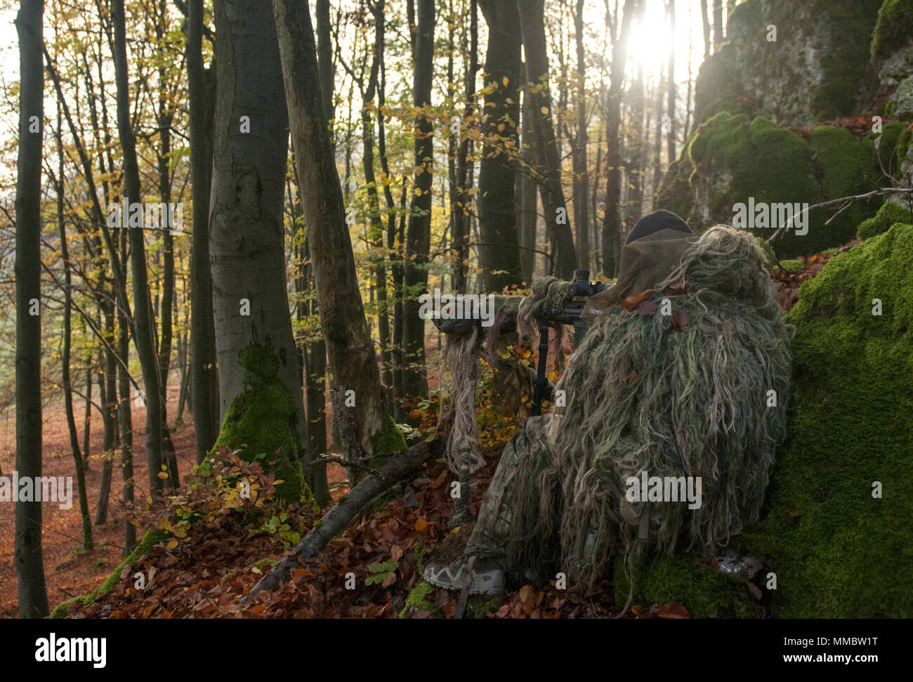 A student prepares to take a shot during the Basic Sniper Course, conducted by the International Special Training Centre at the Joint Multinational Readiness Center in Hohenfels, Germany, October 24, 2017. The ISTC is a multinational education and training facility which provides advanced and specialized training at the tactical level for Special Operations Forces and similar units from the Memorandum of Understanding, NATO and Partnership for Peace nations. (SOCEUR Stock Photo