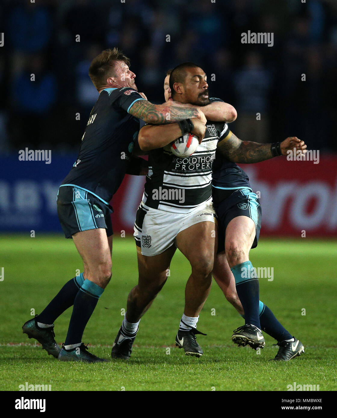 Featherstone Rovers Anthonay Thackeray (left) and Connor Farrell (right) tackle Hull FCs Sika Manu during the Ladbrokes Challenge Cup sixth round match at the LD Nutrition Stadium, Featherstone Stock Photo