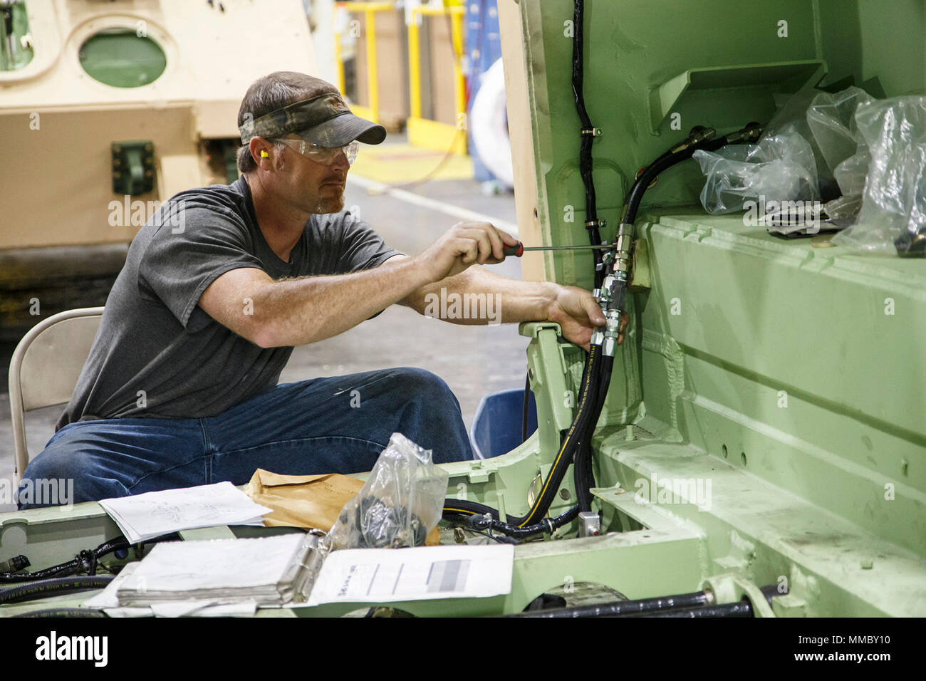 Joel Pettus assembles wiring components for a M113A3/MBT Main Battle ...