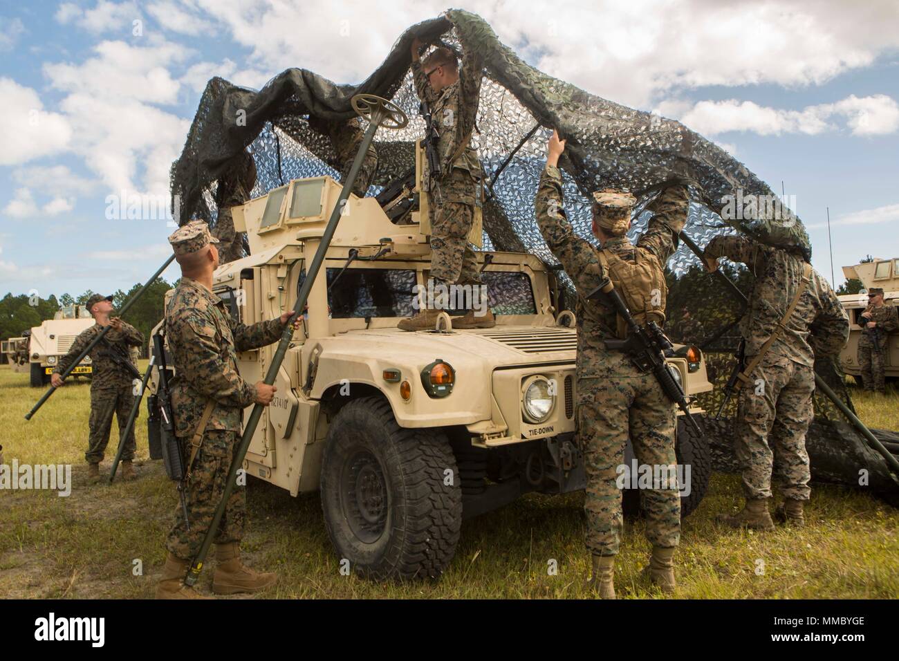 https://c8.alamy.com/comp/MMBYGE/marines-with-2nd-transportation-support-battalion-2nd-marine-logistics-group-learn-how-to-properly-set-up-camouflage-netting-around-a-high-mobility-multipurpose-wheeled-vehicle-during-a-convoy-operation-at-camp-lejeune-nc-oct-5-2017-2nd-tsb-was-charged-with-ensuring-transportation-capabilities-of-personnel-equipment-and-supplies-in-support-of-the-ii-marine-expeditionary-force-us-marine-corps-photo-by-lance-cpl-abrey-d-liggins-MMBYGE.jpg