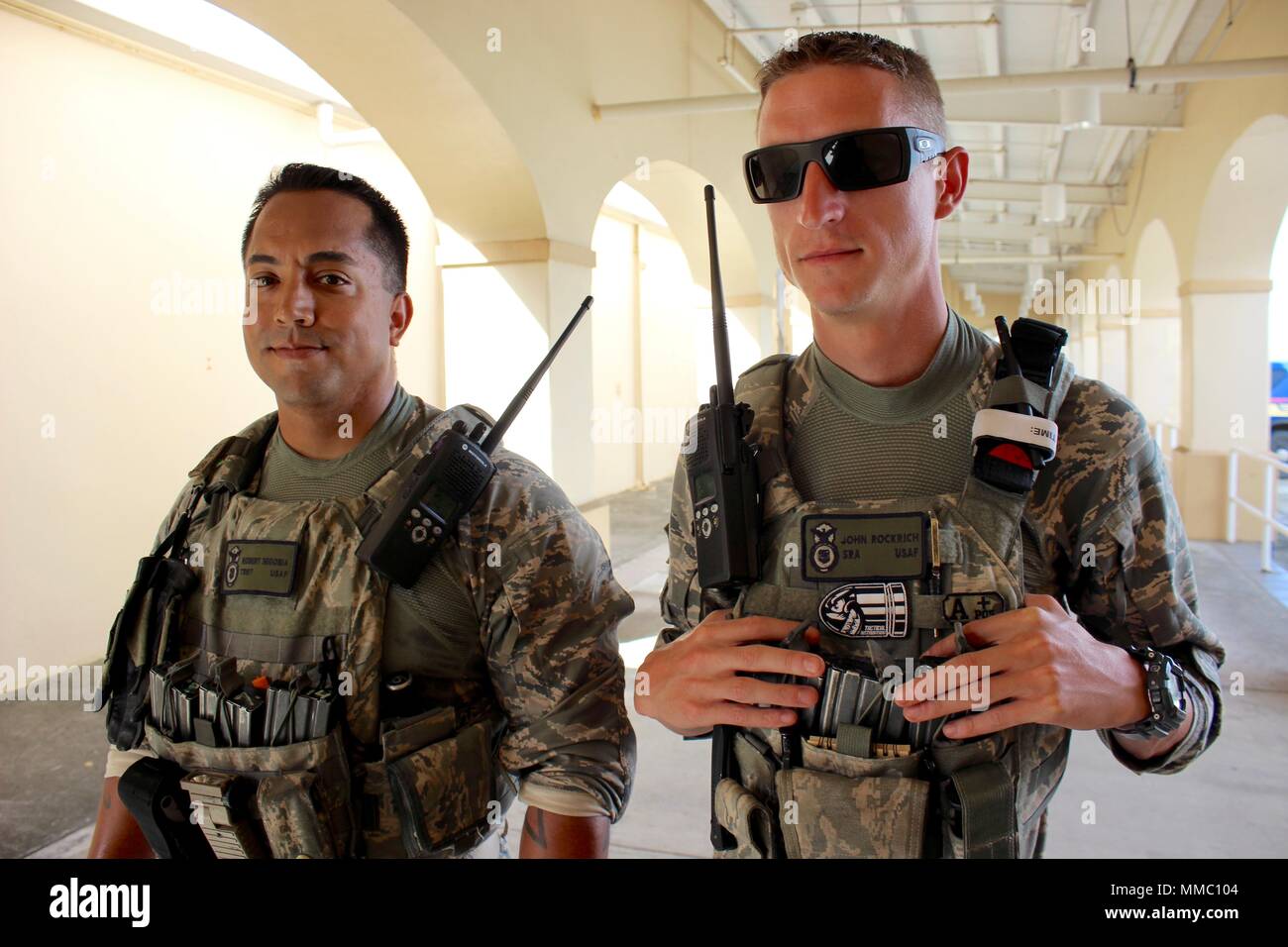 From left, Tech. Sgt. Robert Segobia and Senior Airman Jon Rockrich both members of the Arizona National Guard conduct a foot patrol at the Henry E. Rohlsen International Airport post-Hurricane Maria. National Guard security forces members provide anti-terrorism protection and maintain order at Rohlsen International Airport on the island of St. Croix, alongside members of the Virgin Islands Port Authority. Guardsmen have also supported the Transportation Security Administration (TSA) as the number of commercial flights have increased. Stock Photo