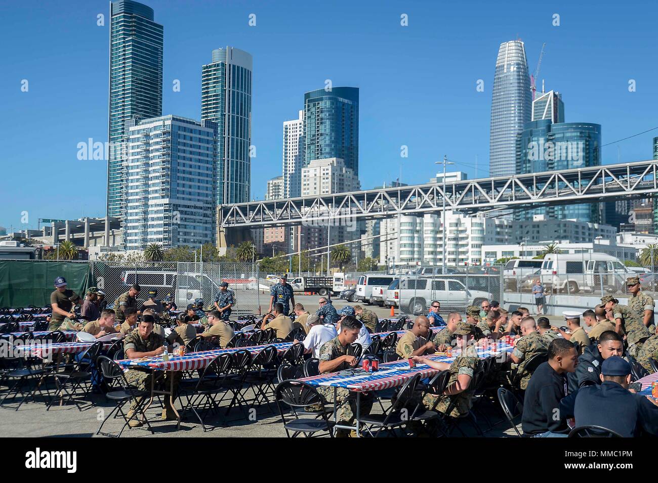 SAN FRANCISCO (Oct. 8, 2017) Sailors, Marines and Coast Guard members attend a barbecue hosted by the Oakland Navy League, Oakland Police Department and local civic organizations during Fleet Week San Francisco 2017. Fleet week provides an opportunity for the American public to meet their Navy, Marine Corps, and Coast Guard team and to experience America’s sea services. Fleet Week San Francisco will highlight naval personnel, equipment, technology, and capabilities, with an emphasis on humanitarian assistance and disaster response. (U.S. Navy photo by Mass Communication Specialist 1st Class An Stock Photo