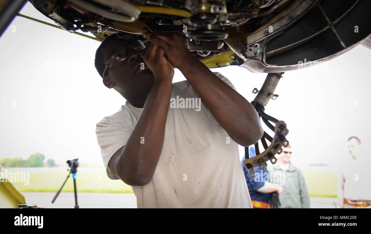 Senior Airman Denzel Henderson, 96th Aircraft Maintenance Unit electrical and environmental systems technician, changes a drive generator on a B-52 Stratofortress at Fairford Royal Air Force Base, U.K., Sept. 20, 2017. Drive generators must be changed if they overheat during a flight. The change takes around six hours to complete and will ensure continued power for B-52 electrical systems. (U.S. Air Force photo/Staff Sgt. Benjamin Raughton) Stock Photo