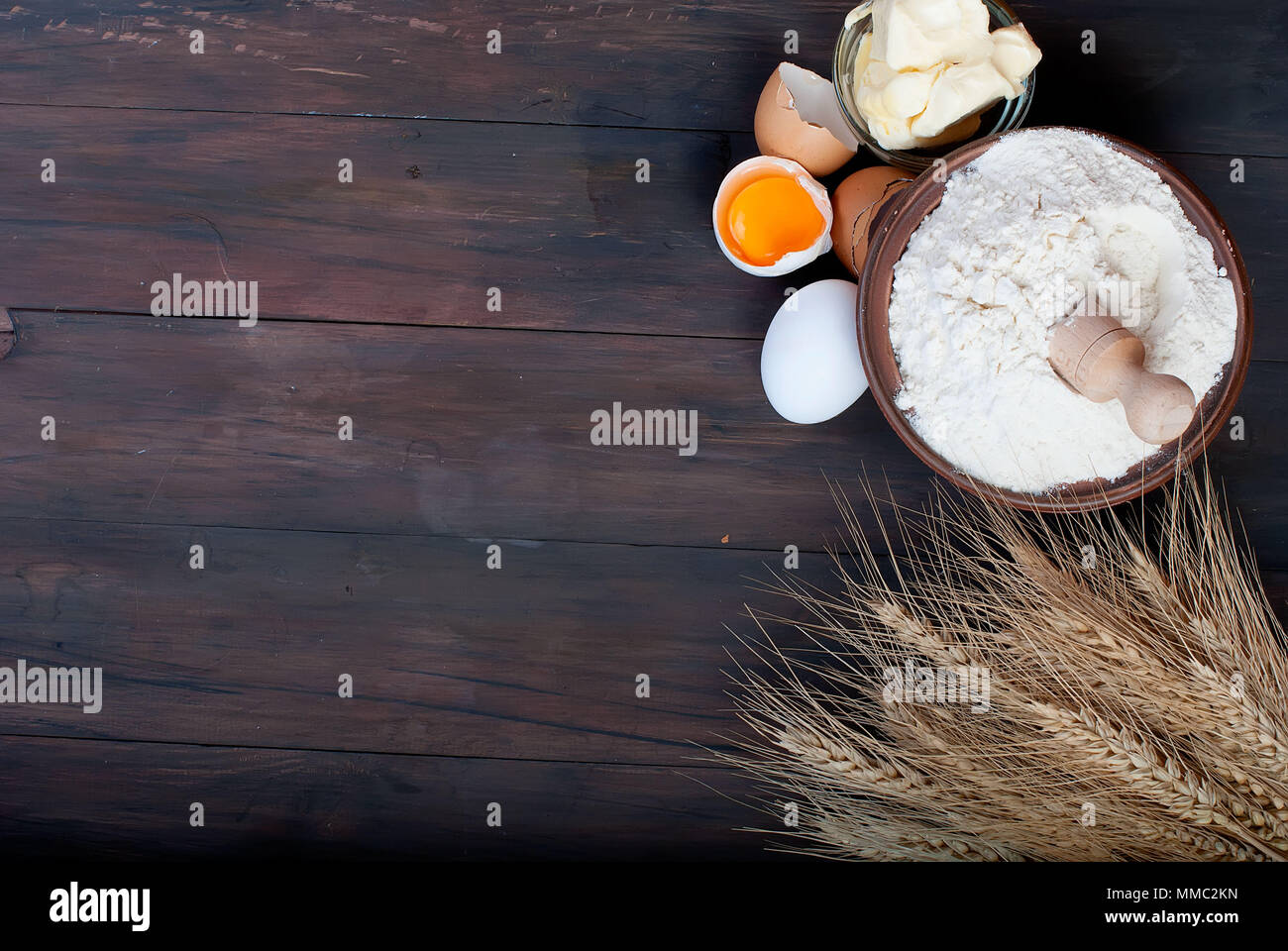 baking background with bake ingredients, ears, egg, Yolk, shell, flour