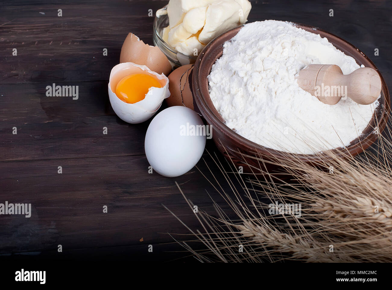baking background with bake ingredients, ears, egg, Yolk, shell, flour