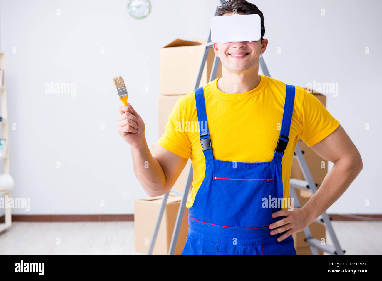 Painter contractor working with virtual reality goggles Stock Photo