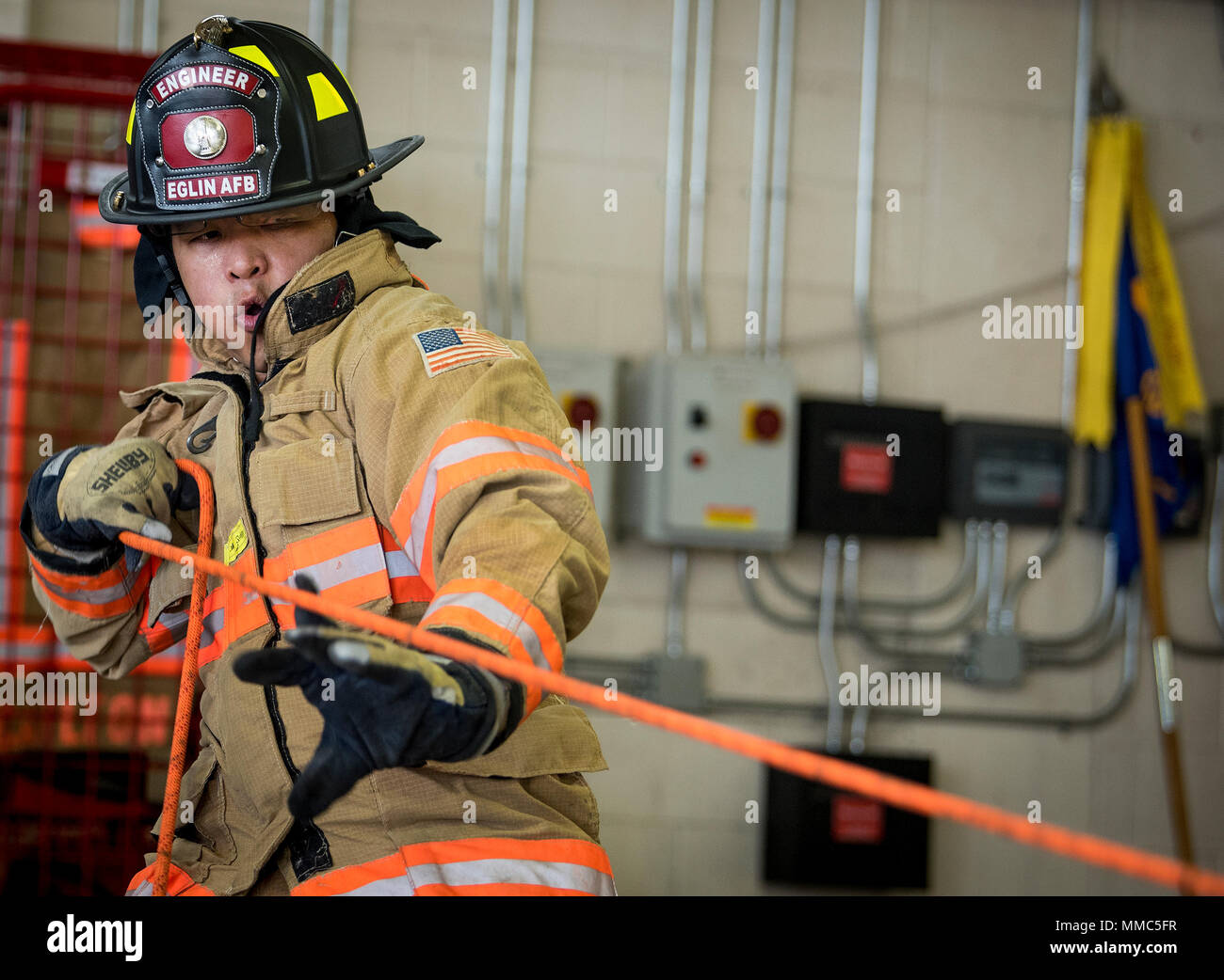 Maj. Tyrone Manegdgeg, 96th Civil Engineer Squadron commander, reels in ...