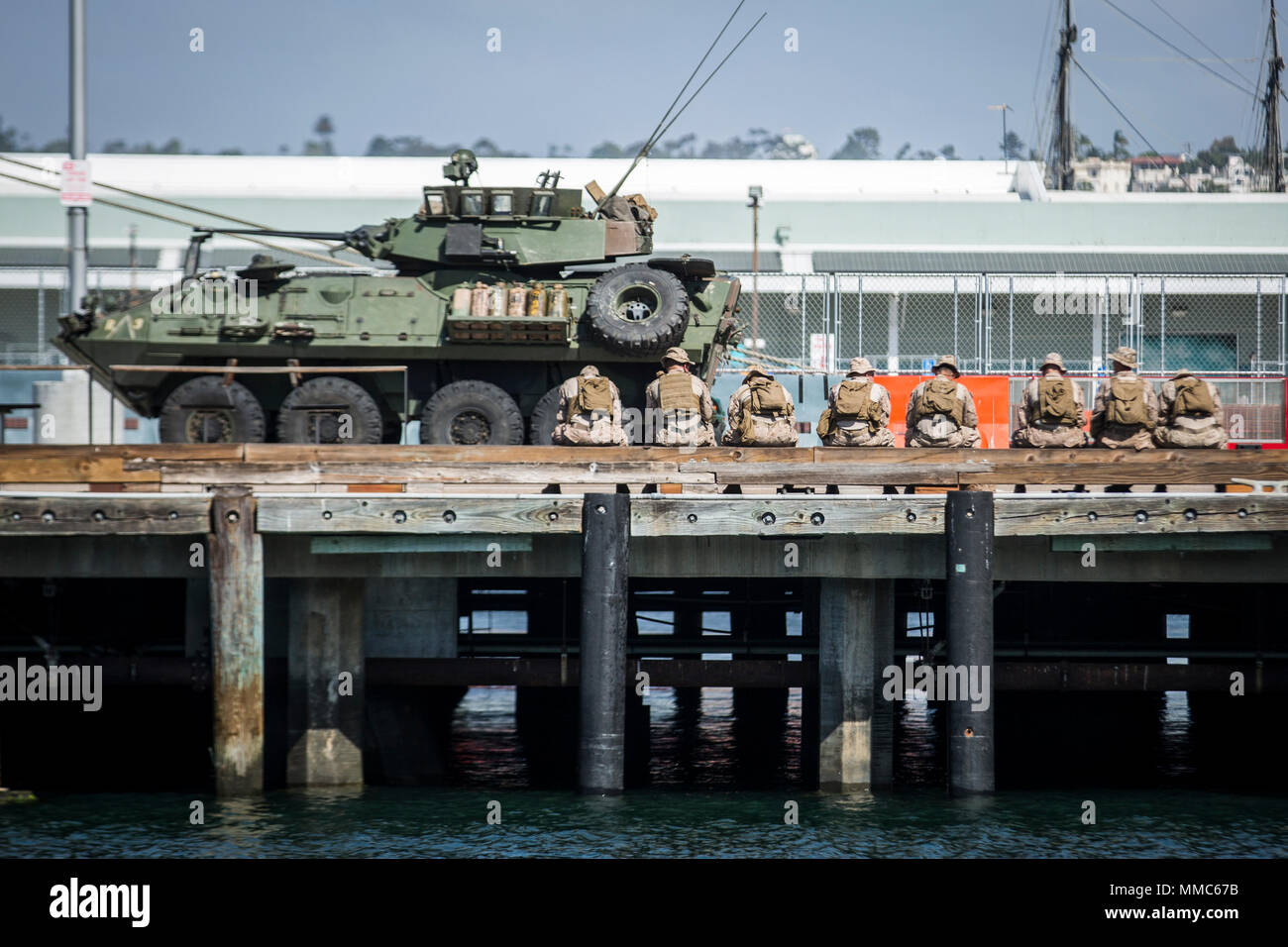 Marines with 3rd Light Armored Reconnaissance Battalion, 1st Marine Division, 1st Marine Expeditionary Force sit next to their vehicles on the Broadway Pier in San Diego, Calif., Oct. 11, 2017 as part of San Diego Fleet Week. Fleet week provides an opportunity for the American public to meet their Marine Corps, Navy and Coast Guard team and experience America's sea services. (U.S. Marine Corps photo by Lance Cpl. Gabino Perez) Stock Photo