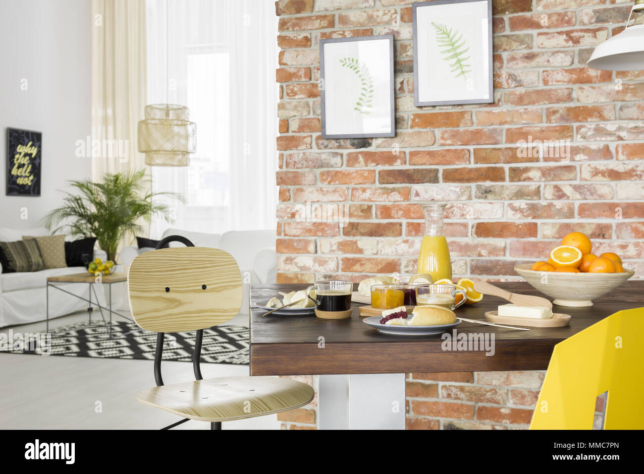 Industrial style dining room with wood table and chair Stock Photo Alamy