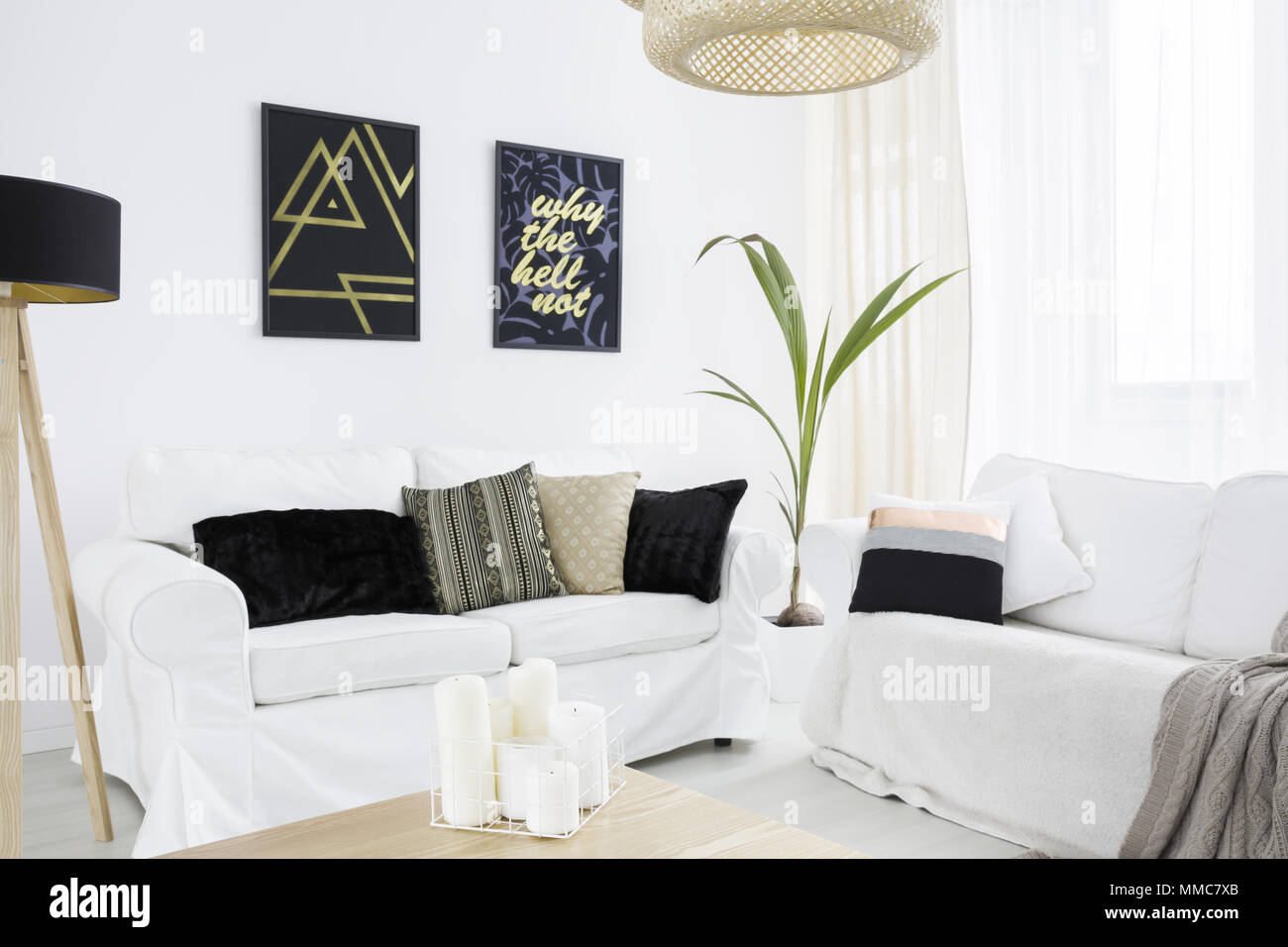 New Living Room With White Couch Black Lamp And Pillows Stock